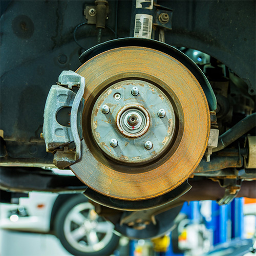 A yellow brake disc opened for brake service in Seminole