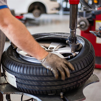 A tire being switched out during car service in Seminole